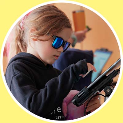 A photo of a child signing in on an iPad